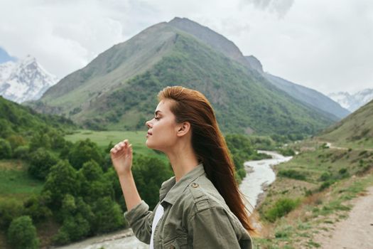 Woman tourist mountains travel landscape nature vacation. High quality photo