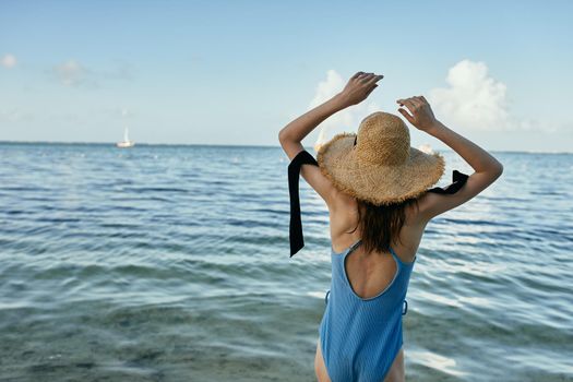woman in swimsuit jungle exotic tropical green leaves. High quality photo