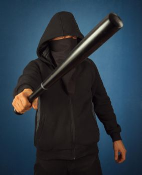 Dangerous man with baseball bat ready for fight