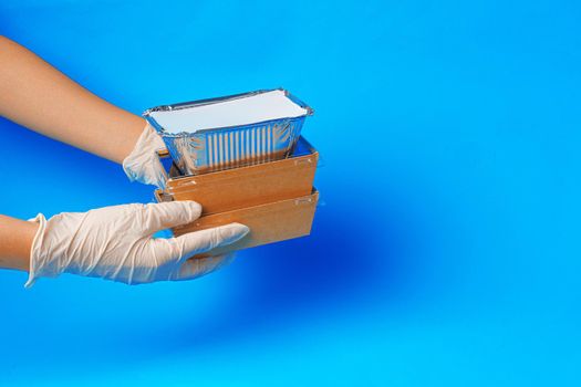 Delivery man hands giving food containers and packages. Delivery concept