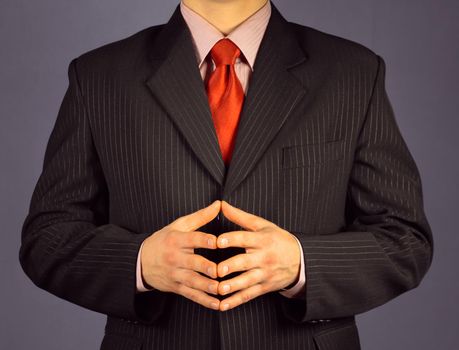 Businessman in a suit concentrated, face is not visible
