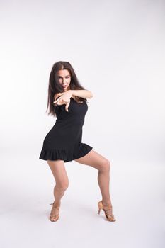 Latina dance, strip dance, contemporary and bachata lady concept - Woman dancing improvisation and moving her long hair on a white background