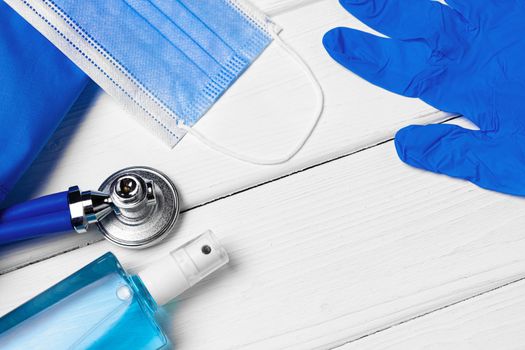 Doctors uniform with mask, stethoscope and other tools close up