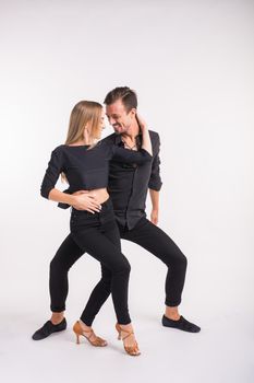 Beauty couple dancing social dance. Kizomba or bachata or semba or taraxia , on white background.