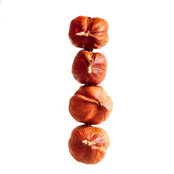 Four of hazelnut on white background