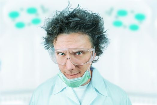 Portrait of a crazy man doctor in a hospital