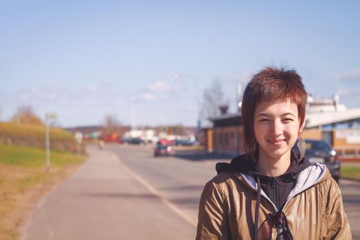 Portrait of a female on the background of the street