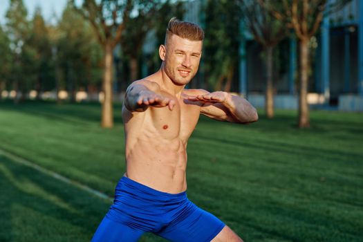 man in the park workout outdoor exercise. High quality photo