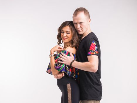 Beauty couple dancing social dance. Kizomba or bachata or semba or taraxia , on white background.