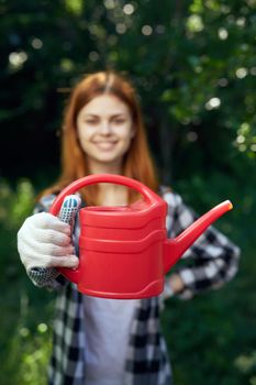 woman gardening trees nature lifestyle green leaves. High quality photo