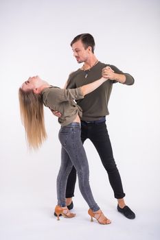 Beauty couple dancing social dance. Kizomba or bachata or semba or taraxia , on white background.