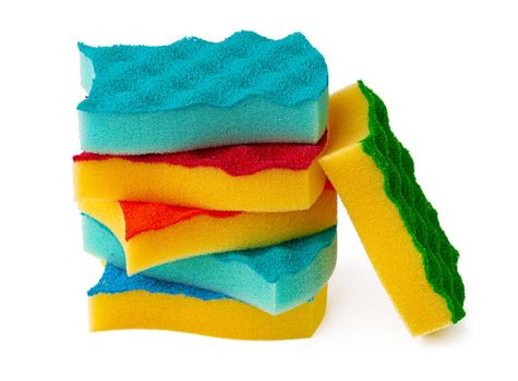 Stack of kitchen sponges isolated on white background, close up