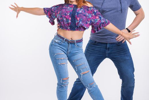 Beauty couple dancing social dance. Kizomba or bachata or semba or taraxia , on white background.