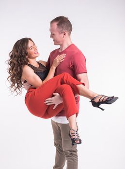 Beauty couple dancing social dance. Kizomba or bachata or semba or taraxia , on white background.