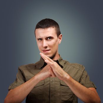 Young man making a enough sign with his hands