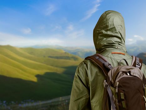 Hiker man enjoying view at nature with backpack.
