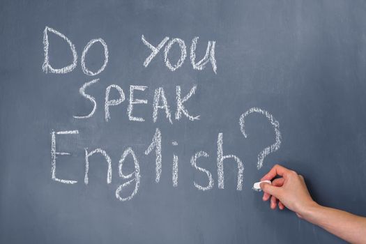 Sentence written on the blackboard: Do you speak English?