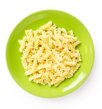 Macaroni on green plate, top view
