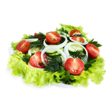 Fresh salad of cucumber, cherry tomatoes, onion rings and dill, side view