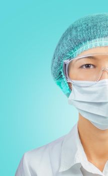 Portrait of young woman doctor or laboratory assistant in cap, glasses and mask