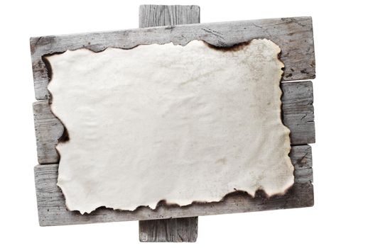 Old burnt paper on a wooden board. Space for text