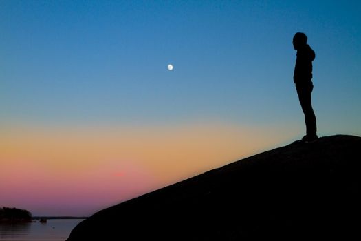Woman enjoying the silence during a wonderful sunset