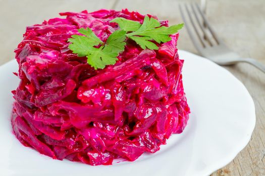 Healthy salad from boiled beet on white plate