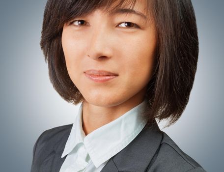 Close-up portrait of a young smiling businesswoman