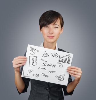 Young businesswoman holds a white paper banner with creative project