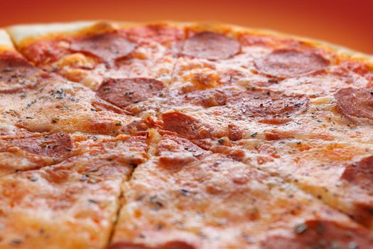 Pepperoni pizza on a red background