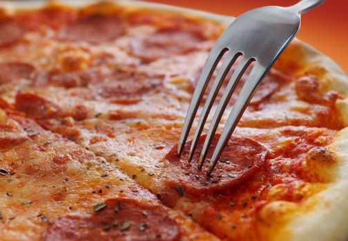 Close-up of a piece of pizza and fork
