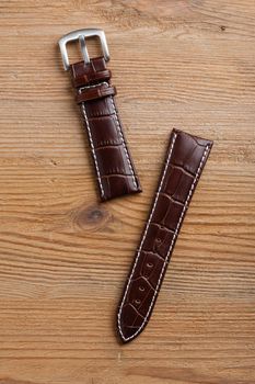 closeup brown crocodile grain leather watch band