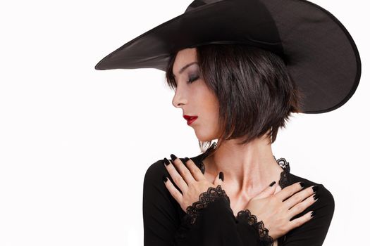 Halloween witch with arms crossed on the chest