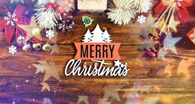 Christmas wooden background with snow fir tree. View with copy space . Copy space framed by Christmas tree branches, decorations, sweets.