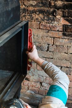 Installation of a large metal fireplace with a water circuit in the house, a profitable fireplace for heating. new