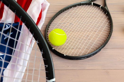 Tennis equipment on wooden surface
