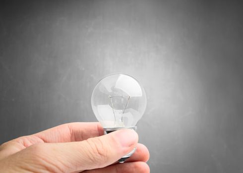 Light bulb in hand close-up