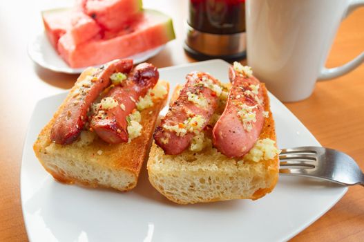 Lunch of fried bread with sausages, tea, watermelon for dessert