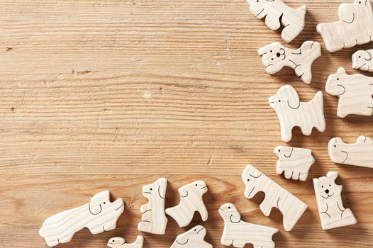 toys background, cute wooden toy animal on wood board, tiny toys and shallow depth of field