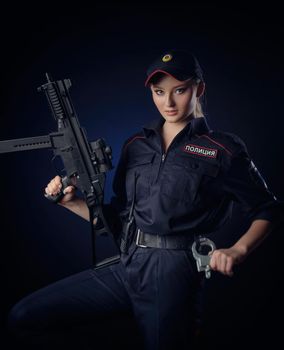 girl in the police uniform with a gun is a Russian policeman. English translation of Police