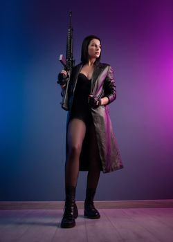 brunette in a leather raincoat with an American automatic rifle with a telescopic sight
