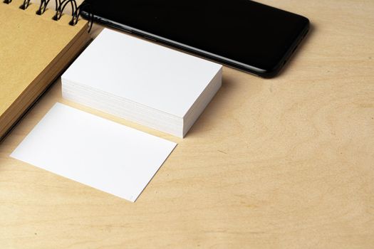 Two piles of blank business cards on table, close up