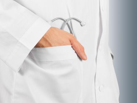 Man's doctor hand with a stethoscope in the pocket , close-up