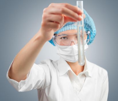 Laboratory female technician looks at successful outcome of research