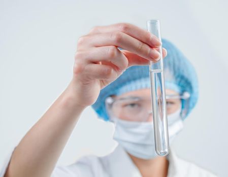 Laboratory technician looks at successful outcome of research