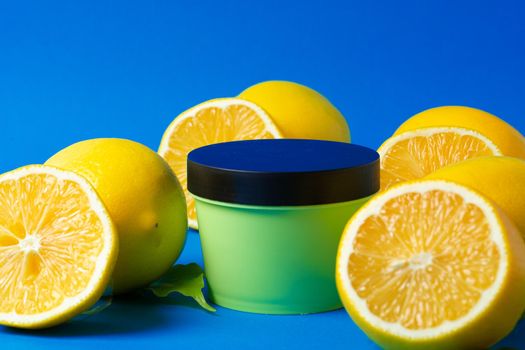 Bottle of skincare cosmetics with sliced lemons. High quality photo