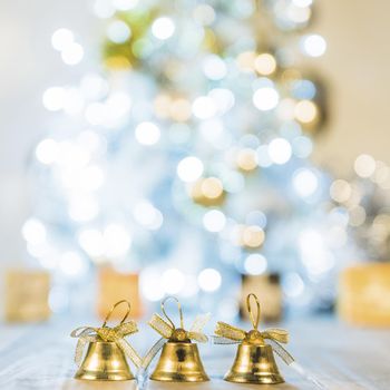 decorative bells near christmas tree