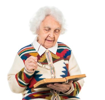 elderly woman flipping an old book isoalted on white background