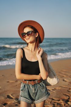 woman walking on the beach landscape sun fun lifestyle. High quality photo