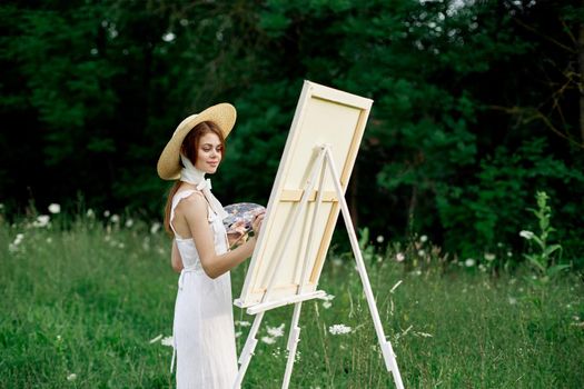 pretty woman in white dress outdoors drawing art creative. High quality photo